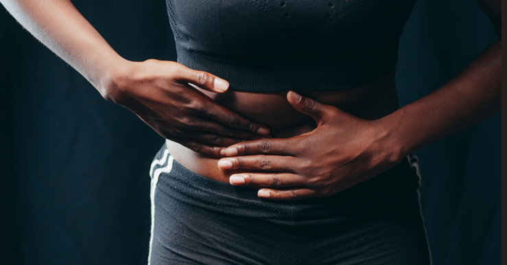 A person having a discomfort due to gas