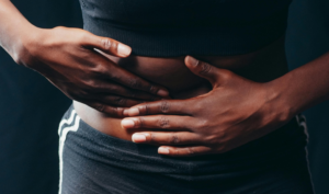 An individual having stomach spasm